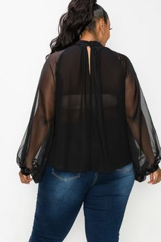 Elegant blouse with sheer back and sheer dolman sleeves. Neck line ornate with oversized bow. True Fit. 100% Polyester Black Top With Sheer Lantern Sleeves, Black Tops With Sheer Lantern Sleeves, Sheer Tops For Workwear In Fall, Chic Tops With Sheer Sleeves For Work, Chic Sheer Long Sleeve Blouse, Sheer Long Sleeve Top For Fall Party, Chic Black Long Sleeve Top With Sheer Sleeves, Long Sleeve Mesh Blouse For Night Out, Long Sleeve Blouse With Mesh Sleeves For Fall