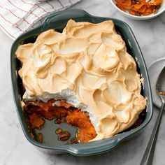 a casserole dish with whipped cream on top