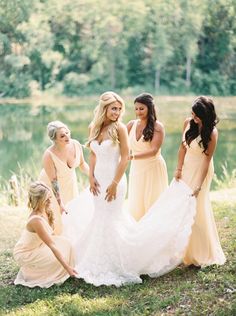 the bridesmaids are getting ready to walk down the aisle in their wedding dresses