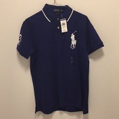 This Is A Blue Ralph Lauren Usa Polo And It Has Never Been Worn And It Includes The Tag Blue Collared Polo Shirt For Spring, Blue Crew Neck Polo Shirt For Summer, Fitted Blue Polo Shirt For Spring, Blue Polo Collar Shirt For Spring, Blue Fitted Collared T-shirt, Blue Ralph Lauren Polo Shirt, Navy Ralph Lauren Short Sleeve Tops, Ralph Lauren Navy Short Sleeve Tops, Blue Ralph Lauren Cotton Tops