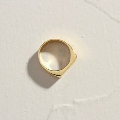 Our brand new 18K Gold Plated Level Ring. Beautifully flat, with a lovely precision feeling when worn, especially stacked with your other favourites, or just on her own, as a subtle addition to your outfit. When you're not wearing this piece, tuck it away in your very own Milou jewellery box provided. Stainless Steel, plated with 18K Gold Waterproof (Tarnish Resistant) Natural Linen Milou Jewellery Box Included For ring sizing, please see our Size Guide for details FREE (WORLDWIDE) SHIPPING Everyday Gold Plated Open Signet Ring, Minimalist Wide Band Open Ring For Formal Occasions, Modern Gold Plated Rings With Thick Band, Simple Open Ring For Formal Occasions, Classic Wide Band Open Ring, Tarnish Resistant, Classic Tarnish Resistant Wide Band Open Ring, Simple Gold Signet Ring For Everyday, Gold Open Ring For Everyday, Minimalist Gold Wide Band Ring For Formal Occasions