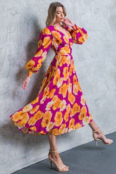 Look effortlessly stylish in this printed floral dress. Featuring a V neckline, long sleeves with smocked cuffs, a waist yoke, pleated skirt, and smocked back waistband, this midi dress is perfect for making a fashionable statement. DetailsSelf : 100% PolyesterLining : 100% Polyester Size & Fit - Model is 5`8" And Wearing Size Small- Measurements Taken From Size Small- Approx. Length: 49" Spring Long Sleeve Midi Dress With Pleated Waist, Spring Long Sleeve Pleated Dress With Pleated Waist, Long Sleeve Pleated Hem Dress For Summer, Fitted Floral Print Midi Pleated Dress, Casual Long Sleeve Pleated Spring Dress, Spring Floral Midi Dress With Pleats, Spring Midi Length Pleated Floral Dress, Summer Long Sleeve Midi Dress With Pleated Hem, Spring Pleated Midi Floral Dress