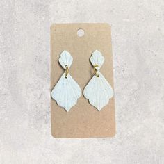 Handmade, lovely textured white drop earrings. These are elegant enough for a wedding, but classic enough for casual wear. Made from a mixture of clay creating a speckled white look, on resin reinforced hypoallergenic posts. Drop length is just shy of 2 inches. Handmade White Teardrop Dangle Earrings, Minimalist White Teardrop Earrings For Gift, White Minimalist Hypoallergenic Teardrop Earrings, Minimalist White Teardrop Earrings, White Minimalist Teardrop Dangle Earrings, Minimalist White Teardrop Earrings For Wedding, Earrings For Wedding, White Look, Jewelry Flower