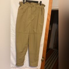 Khaki Pants With Paper Bag Elastic Waist Tab With Button For Tightening At The Ankle Length 39.5” Inseam 26” Waist 14” Rise 13.5” Approx Nwt Utility Paperbag Waist Bottoms With Pockets, Paperbag Waist Cargo Pants With Pockets For Workwear, Utility Pants With Paperbag Waist For Workwear, Utility Paperbag Waist Pants For Workwear, Utility Style Paperbag Waist Pants For Work, Paperbag Waist Cargo Pants For Work, Casual Cargo Pants With Paperbag Waist For Work, Workwear Khaki Bottoms With Elastic Waistband, Khaki Bottoms With Elastic Waistband For Work