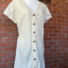 Women’s Calf Length Button Front, Cream Colored Dress. 22” Ptp. Smoke And Pet Free Home. Casual Beige Button-up Dress, Casual Button-up Midi Dress For Daytime, Casual Shirt Dress With Buttons For Daytime, Casual Button Shirt Dress For Daytime, Casual Dresses With Button Back, Casual Dresses With Button Back For Day Out, Casual Beige Mini Dress With Buttons, Daytime Cotton Dresses With Buttons, Casual Daytime Dress With Button Closure