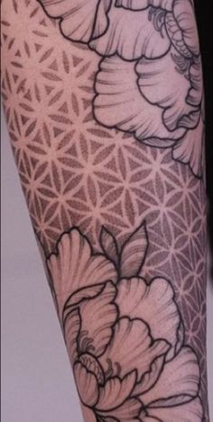 a woman's leg with flowers on it