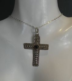 A vintage silver boho style cross pendant with a central cabachon garnet set in. comes complete on a silver 18 inch chain. cross measures 4.5cm high x 3.2cm wide. stamped 925 for silver. Antique Silver Cross Necklace In Sterling Silver, Antique Silver Sterling Silver Cross Necklace, Bohemian Jewelry With Large Cross Pendant, Silver Ankh Cross Necklace In Spiritual Style, Bohemian Sterling Silver Cross Jewelry, Bohemian Silver Cross Pendant Jewelry, Vintage Silver Sterling Silver Cross Necklace, Silver Ankh Cross Necklace Spiritual Style, Silver Bohemian Cross Necklace