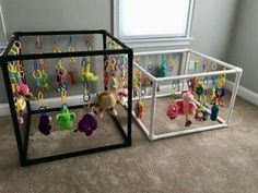 two playpens with stuffed animals and toys in them on the floor next to each other