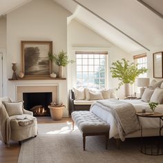 a bedroom with a bed, chair and fireplace in it