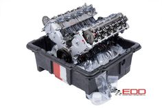 an engine in a plastic container with the words edd printed on it's side