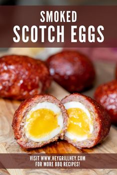 an egg is cut in half on a cutting board with the words smoked scotch eggs