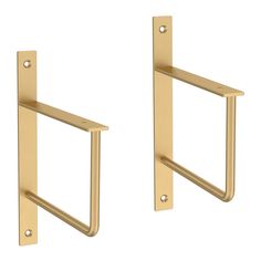 two brass colored handles on the back of a pair of door handles, each with a square handle