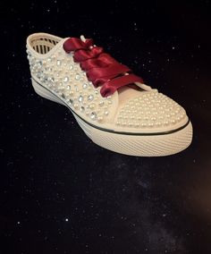 These custom sneakers are pearl and rhinestone mix all over the shoe with all diamond like rhinestone toe accents. The satin ribbon shoe lace and custom details will be in Burgundy color, other pictures to show details.  I can customize this shoe for any occasion, wedding, Quince, or anything you desire.  I make these per order, the pearls and rhinestones are all hand placed with no pattern,  the custom details are not iron on or paint, they are also hand placed rhinestones. You provide the cust Sneakers Wedding, Bling Sneakers, Ribbon Shoe Laces, Bridal Sneakers, Ribbon Shoes, Pearl Shoes, Wedding Sneakers, Rhinestone Shoes, Sneakers Athletic