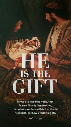 a poster with the words he is the gift and an image of a man holding a baby