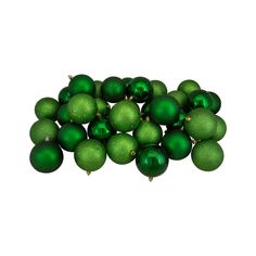 a pile of green christmas balls sitting on top of each other