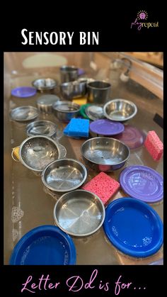 a table topped with lots of bowls and pans