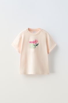 Zara Summer T-shirt With Text Print, Zara T-shirt With Letter Print And Relaxed Fit, Pink Slogan T-shirt With Short Sleeves, Trendy Crew Neck T-shirt With Embroidered Text, Trendy Zara Graphic Print T-shirt, Summer Short Sleeve T-shirt With Embroidered Text, Spring Letter Print Short Sleeve T-shirt, Basic Graphic Print Summer T-shirt, Basic Graphic Print T-shirt For Summer