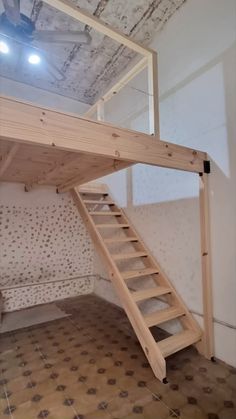 there is a loft bed with stairs to the top