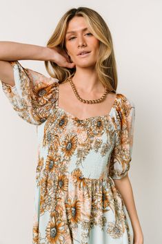 Adria Mini Dress | Camel + Blue | Baltic Born Bohemian Mini Dress With Smocked Bodice And V-neck, Bohemian Floral Dress With Smocked Bodice For Vacation, Bohemian Floral Dress With Smocked Bodice, Bohemian Mini Dress With Square Neck For Vacation, Bohemian Dress With Elastic Neckline For Day Out, Flowy Square Neck Floral Dress For Vacation, Blue And Bronze, Smocked Mini Dress, Baltic Born