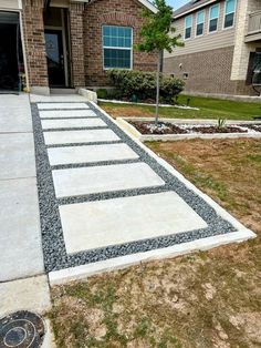 a driveway that has been laid out in front of a house