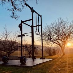 an outdoor gym in the middle of a field