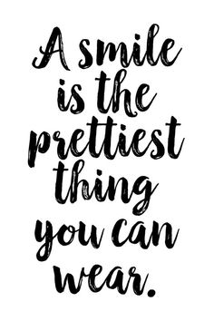 a smile is the prettiest thing you can wear handwritten quote on white background