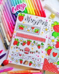 an open coloring book surrounded by crayons and markers