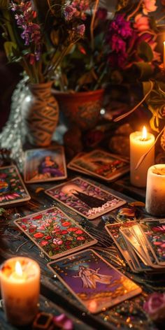 candles, cards and flowers on a table