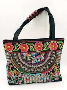 Check out this item in my Etsy shop https://www.etsy.com/listing/1474260735/embroidered-shoulder-handbag-from Multicolor Embroidered Handheld Shoulder Bag, Handheld Multicolor Bags With Handwork, Handheld Embroidered Shoulder Bag For Festivals, Traditional Multicolor Embroidered Handheld Bag, Traditional Handheld Bag With Multicolor Embroidery, Festival Embroidered Handheld Shoulder Bag, Embroidered Handheld Shoulder Bag For Festivals, Black Embroidered Bags For Festivals, Black Shoulder Bag For Everyday And Festivals