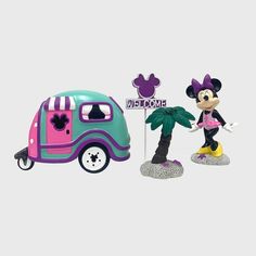 mickey and minnie mouse figurines next to a vw bus