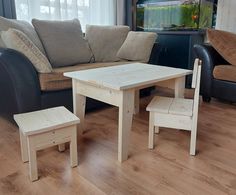 a living room filled with furniture and a wooden table