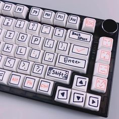 a black and white keyboard with different colored keys