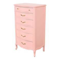 a pink chest of drawers with gold handles