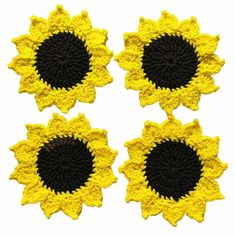 four yellow and black crocheted sunflowers on a white background, each with a single flower in the center