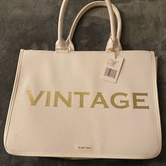 White Canvas Bag With Hard Sides In Gold Lettering It Says “Vintage” On One Side And “Vintage Havana” On The Bottom. Vintage Everyday Shoulder Bag, Vintage Large Capacity Everyday Bag, Vintage Satchel With Large Capacity For Errands, Vintage Satchel For Errands With Large Capacity, Vintage Large Capacity Satchel For Errands, Vintage Satchel Shoulder Bag For Errands, Vintage Large Capacity Shoulder Satchel, Vintage White Shoulder Bag With Large Capacity, Vintage White Tote Shoulder Bag