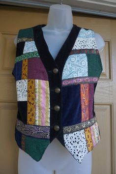 Vintage 90s velvet decorated vest by The Limited. In good vintage condition. Labeled size small - please see measurements to ensure fit.Measurements taken across front laid flat18" across front armpit to armpit16" across front of waist18" - 21" length Fitted Multicolor Patchwork Vest, Multicolor Patchwork Fitted Vest, Fitted Patchwork Vest For Festival, Fitted Sleeveless Patchwork Vest, Vintage Fitted Multicolor Vest, Fitted Vintage Multicolor Vest, Fitted Multicolor Vintage Vest, Fitted Retro Vest For Festivals, 90s Velvet