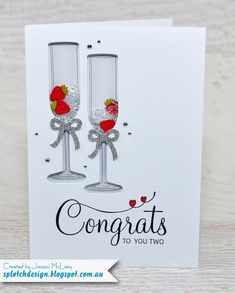 two wine glasses with hearts on them and the words congrats to you two