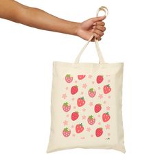 This tote bag is perfect for all your needs. With its reusable design, you can use it as a book bag, grocery bag, or beach bag. The charming strawberries and daisy flowers add a touch of nature to your everyday essentials. This 100% cotton bag comes in one size – 15" x 16"– perfect for everyday wear. Carry your essentials with a burst of sweetness in our fun tote bag. Its pink and red strawberry and daisy design adds a touch of whimsy to your day. Perfect for a picnic or quick errand! The bag fe Rectangular Bag With Strawberry Print As Gift, Rectangular Bags With Strawberry Print As Gift, Rectangular Bags With Strawberry Print For Gifts, Summer Strawberry Print Bag For Daily Use, Summer Strawberry Print Bags For Daily Use, Rectangular Strawberry Print Bag As A Gift, Rectangular Strawberry Print Bag For Gifts, Strawberry Print Tote Bag For Daily Use, Everyday Tote Bag With Strawberry Print