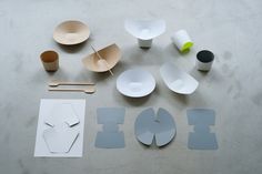 various shapes and sizes of paper sitting on a table