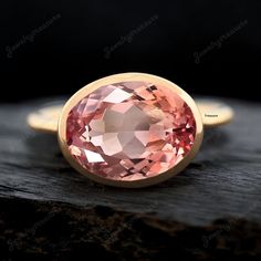 Bi-Color Ceylon Padparadscha Sapphire Bezel Set Ring - Oval Cut Solitaire Bridal Ring - Peach Gemstone Women Stacking Ring - Gift For Her Main Stone- Padparadscha Sapphire (Lab Created) Stone Shape: Oval Stone Color: Orange  Stone Size: 14x10 MM Benefits Of Wearing Padparadscha Sapphire - can bring unique beauty, emotional balance, creativity, and a sense of spiritual connection due to its rare orange-pink hue and symbolic qualities. *Ring Size :- US 3 to US 10 -------------------------------------------------------------------------------------------------------------------------------------------------------------- Customized Design: For custom making jewelry, it can be made in 2 different metals 1. Solid gold, including 14/18k white/yellow gold. 2. 925 sterling silver with white/yellow/ Unique Fine Jewelry, Peach Champagne Sapphire, Sapphire Solitaire Ring, Gift For Love, Orange Stone, Bezel Set Ring, Padparadscha Sapphire, Sapphire Solitaire, Emotional Balance