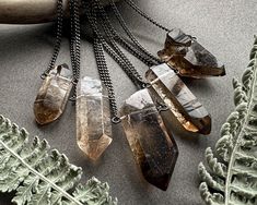 Smoky Quartz Necklace: Carry a piece of the earth with you wherever you go with this stunning raw crystal necklace! Simple and versatile, this little beauty is the perfect accessory for dressing up or down. ✧ Fair-trade Brazilian smoky quartz ✧ 100% natural raw crystal, not irradiated or heat treated ✧ Choose your favorite stone from the dropdown menu ✧ Crystal size 25-50mm (1-2 inches) ✧ Sleek gunmetal chain in your chosen length ✧ Hypoallergenic steel chain on request ✧ Sterling silver or blac Smoky Quartz Necklace, Quartz Crystal Pendant, Raw Crystal Necklace, Raw Crystal Jewelry, Goth Aesthetic, Steel Chain, Quartz Necklace, Crystal Points, Smoky Quartz