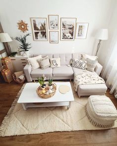 a living room filled with lots of furniture and pictures on the wall above it's coffee table