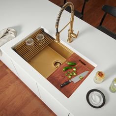 the kitchen sink is clean and ready to be used as a counter top for cutting vegetables