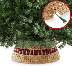 a close up of a christmas tree in a wicker basket with an arrow pointing to it