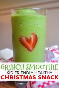 a green smoothie with strawberries in it and the words grinch smoothie kid friendly healthy christmas snack