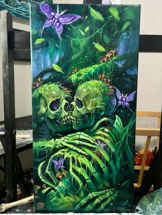 a painting of two skulls in the middle of green plants and butterflies on a black background