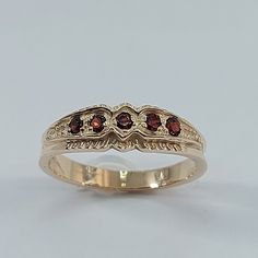 This stunning  style ring has been carefully crafted from scratch in 10k Solid Yellow Gold, and authentic garnet stone. Great for any occasion! Buy it for your-self or for someone you love! This beautiful ring will not go unnoticed. All of my jewelry is handmade from scratch and of high quality. A tracking shipping number will be provided to you once ring has been mailed. Ring Measurements and Materials: Ring is size 7 but can be resized at no extra cost and will be shipped to you in an elegant Promise Ring With Hallmarked Garnet Birthstone, Classic Garnet Signet Ring For Anniversary, Classic Garnet Round Band Rings, Yellow Gold Garnet Rings For Anniversary, Classic Garnet Ring With Round Band, Antique Garnet Promise Ring, Vintage Garnet Birthstone Rings, Gold Garnet Signet Ring For Anniversary, Classic Red Garnet Signet Ring