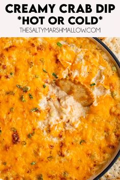 a cheesy crab dip with tortilla chips on the side and text overlay that reads, creamy crab dip hot or cold