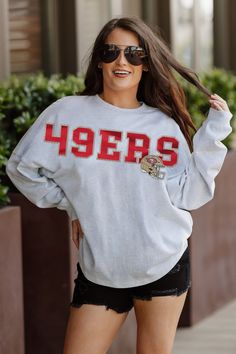 Designed for the ultimate fan, our San Francisco 49Ers drop shoulder long sleeve tee combines a relaxed fit, heathered finish and luxurious French Terry knit. With a ribbed neckline and cuffs, you'll stay stylish and comfortable while showing your unwavering team support. Collegiate Long Sleeve Tops For Game Day, Collegiate Style Long Sleeve Tops For Game Day, Collegiate Long Sleeve Tops For Sports Events, Long Sleeve Tops For Sports Events, Relaxed Fit Long Sleeve Fan Gear Sweatshirt, Relaxed Fit Long Sleeve Sweatshirt For Fans, Long Sleeve Top With Team Name For Fall, Long Sleeve Sports Fan Top With Team Name, Ribbed Neckline