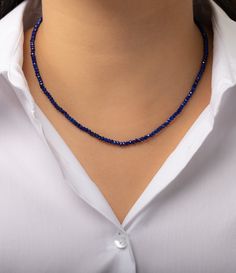 2mm blue lapiz beaded necklace. Wear it by itself or layered, day or night. Made in L.A. Blue Lapiz Beads: 2mm Length: 14- 16" adjustable Ships in 6-9 business days Rush order ships in 3-5 business days Comes gift ready in a custom Zoe Lev jewelry box Everyday Lapis Lazuli Jewelry With Gemstone Beads, Adjustable Single Strand Sapphire Necklace, Sapphire Single Strand Lapis Lazuli Jewelry, Sapphire Single Strand Necklace With Round Beads, Sapphire Color Single Strand Lapis Lazuli Jewelry, Sapphire Jewelry With Faceted Round Beads, Sapphire Beaded Rondelle Jewelry, Sapphire Colored Lapis Lazuli Single Strand Necklace, Sapphire Lapis Lazuli Jewelry With Faceted Details